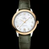 34 mm, steel ‑ yellow gold on leather strap