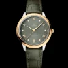 34 mm, steel ‑ yellow gold on leather strap